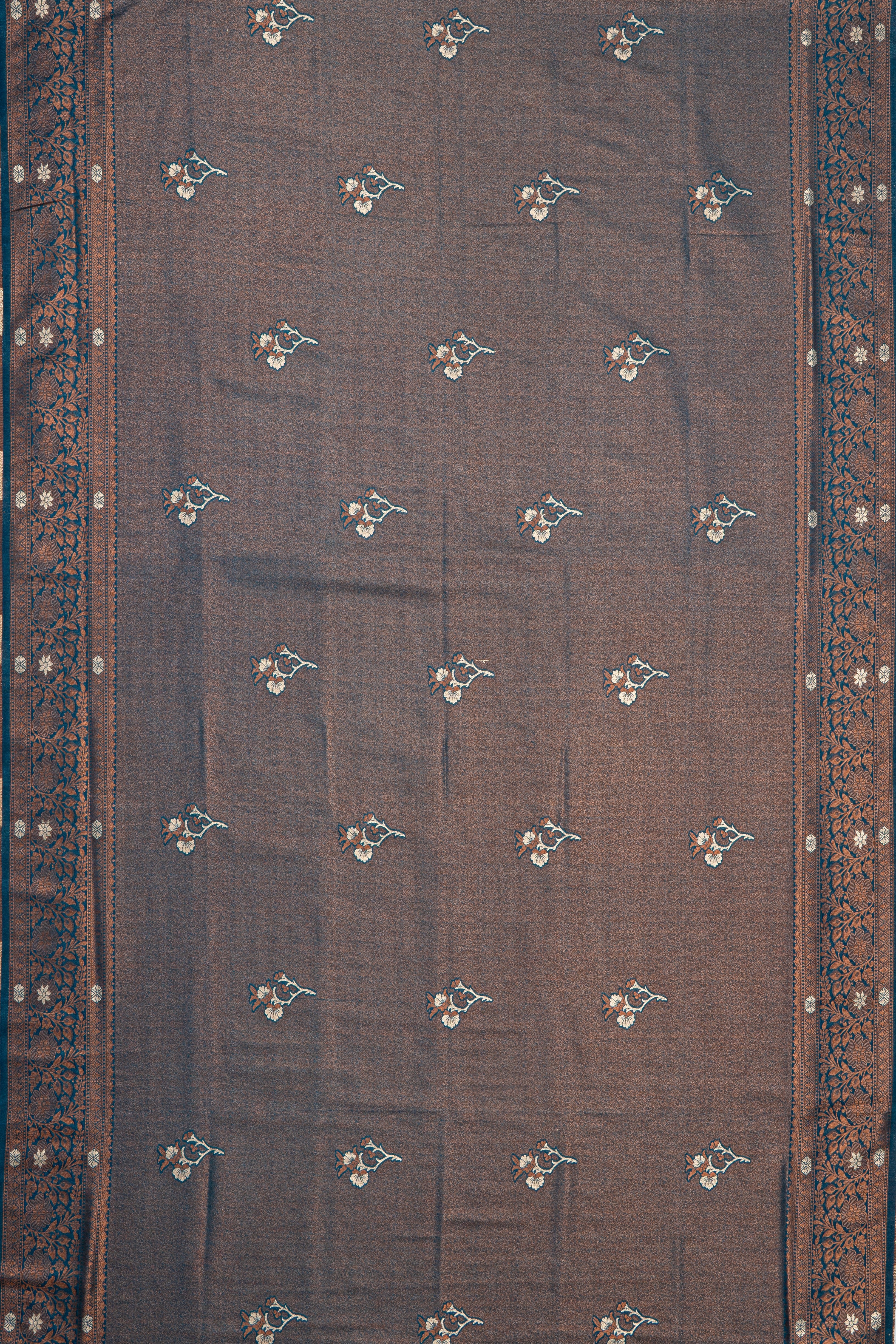 Dhoop Chaon Copper Blue Soft Silk Saree with Gold and Silver Floral motifs