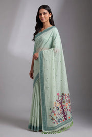 Pastel Green Cotton Paithani Saree with Mṛgataru-Padmāvalī Pallu and contrast Forest Munya border