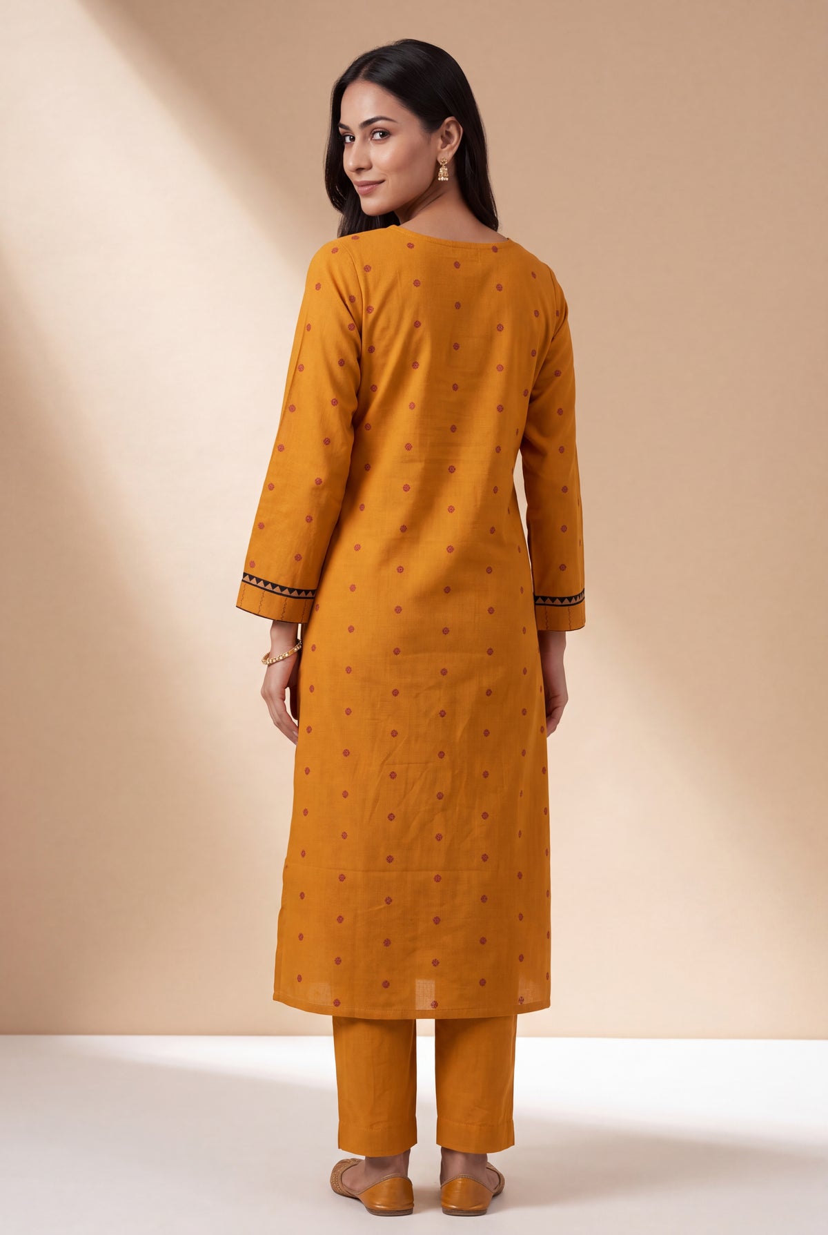 Mustard Cotton Kurti with Rust Butti and Chakrāvalī Patchwork