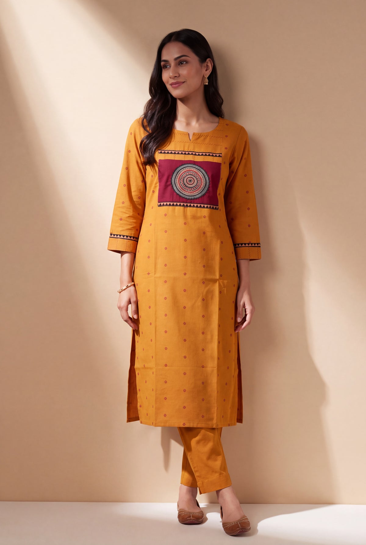 Mustard Cotton Kurti with Rust Butti and Chakrāvalī Patchwork