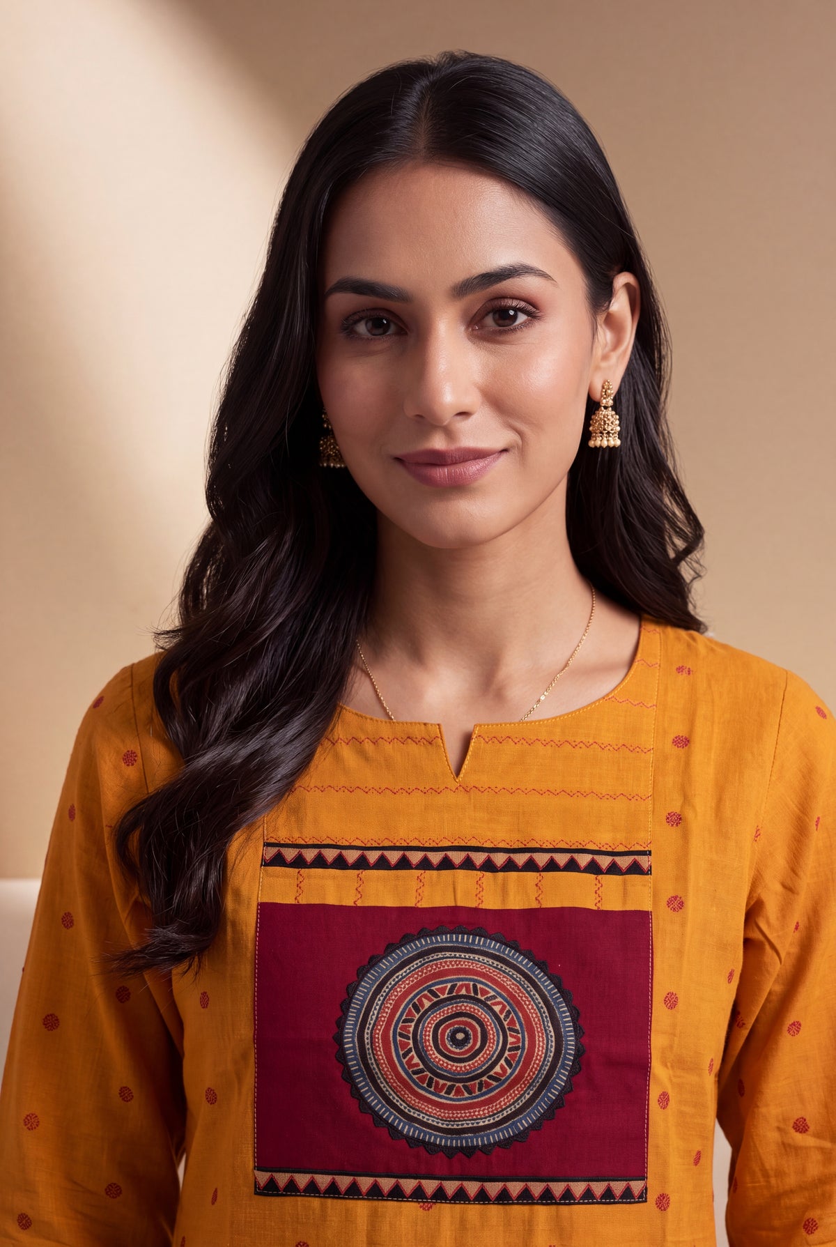 Mustard Cotton Kurti with Rust Butti and Chakrāvalī Patchwork