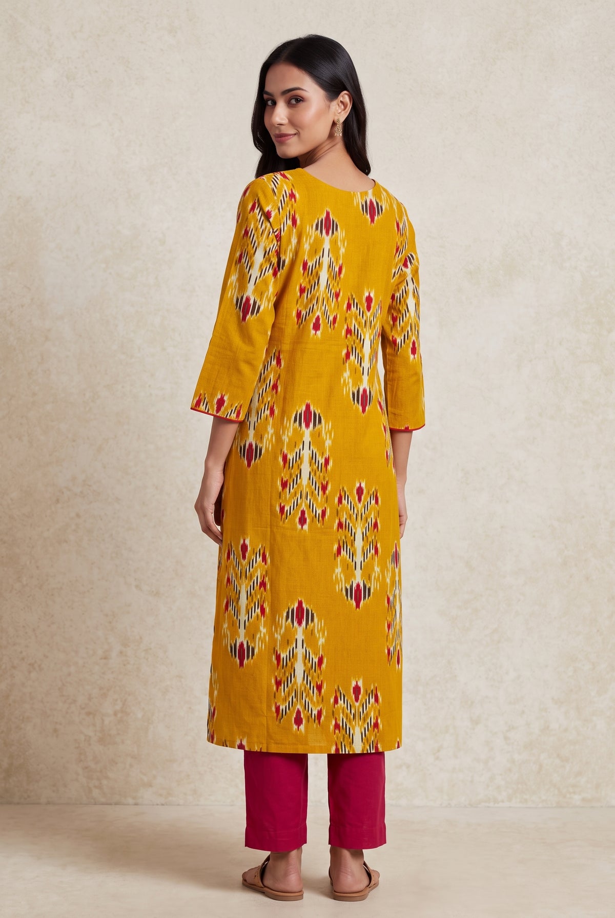 Haldi Yellow Cotton Kurti with Rani Pink Ikat-inspired motifs
