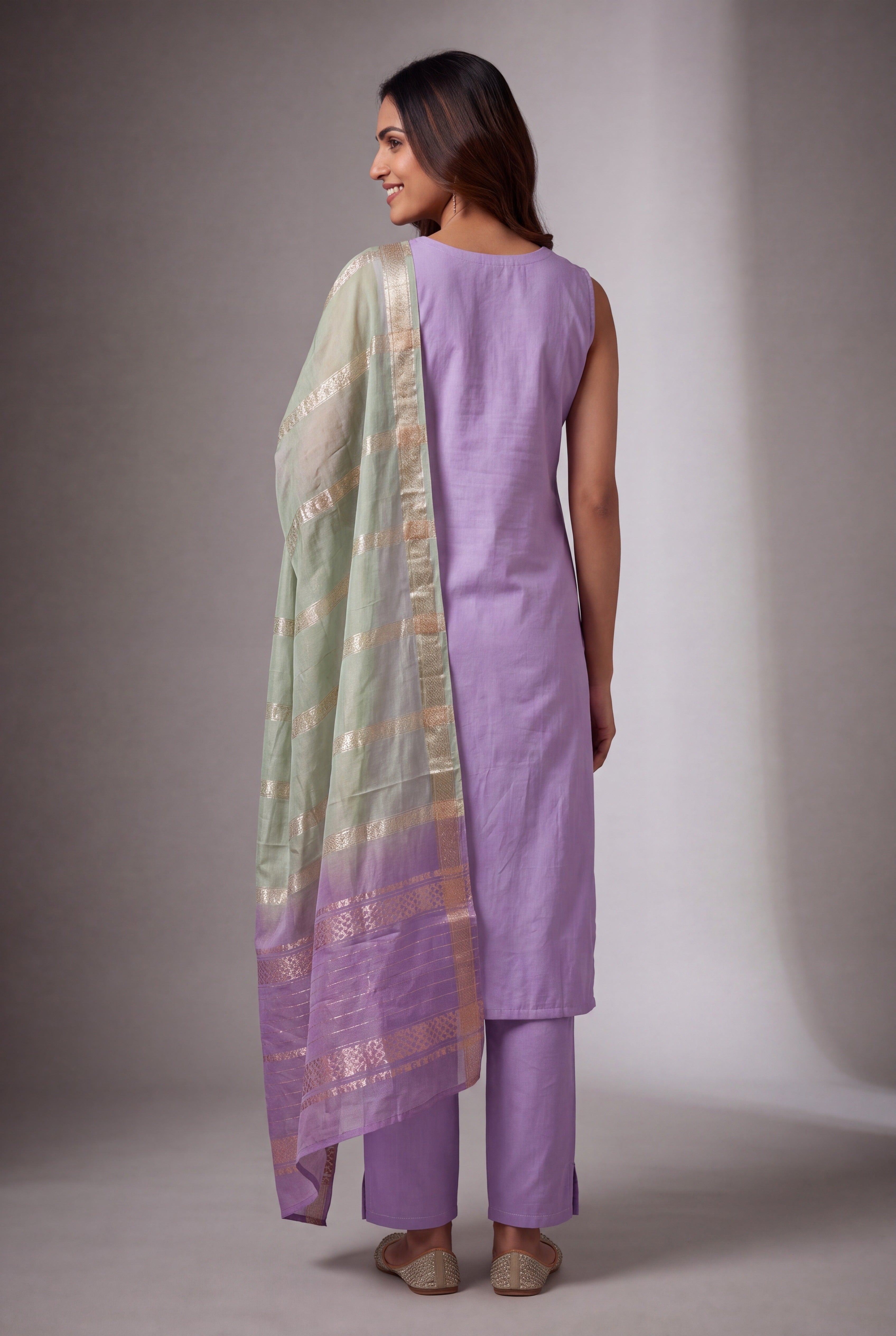 Lavender Soft Silk Suit Set with Haripuṣpa threadwork and Sequin work
