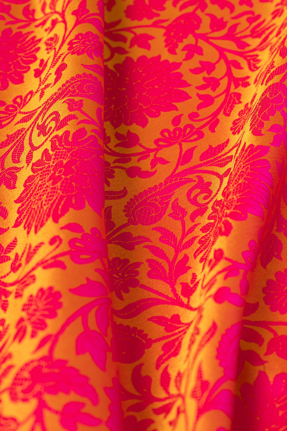 Mustard Yellow Katan Silk Banarasi Saree with Embossed Rani Pink Floral weave