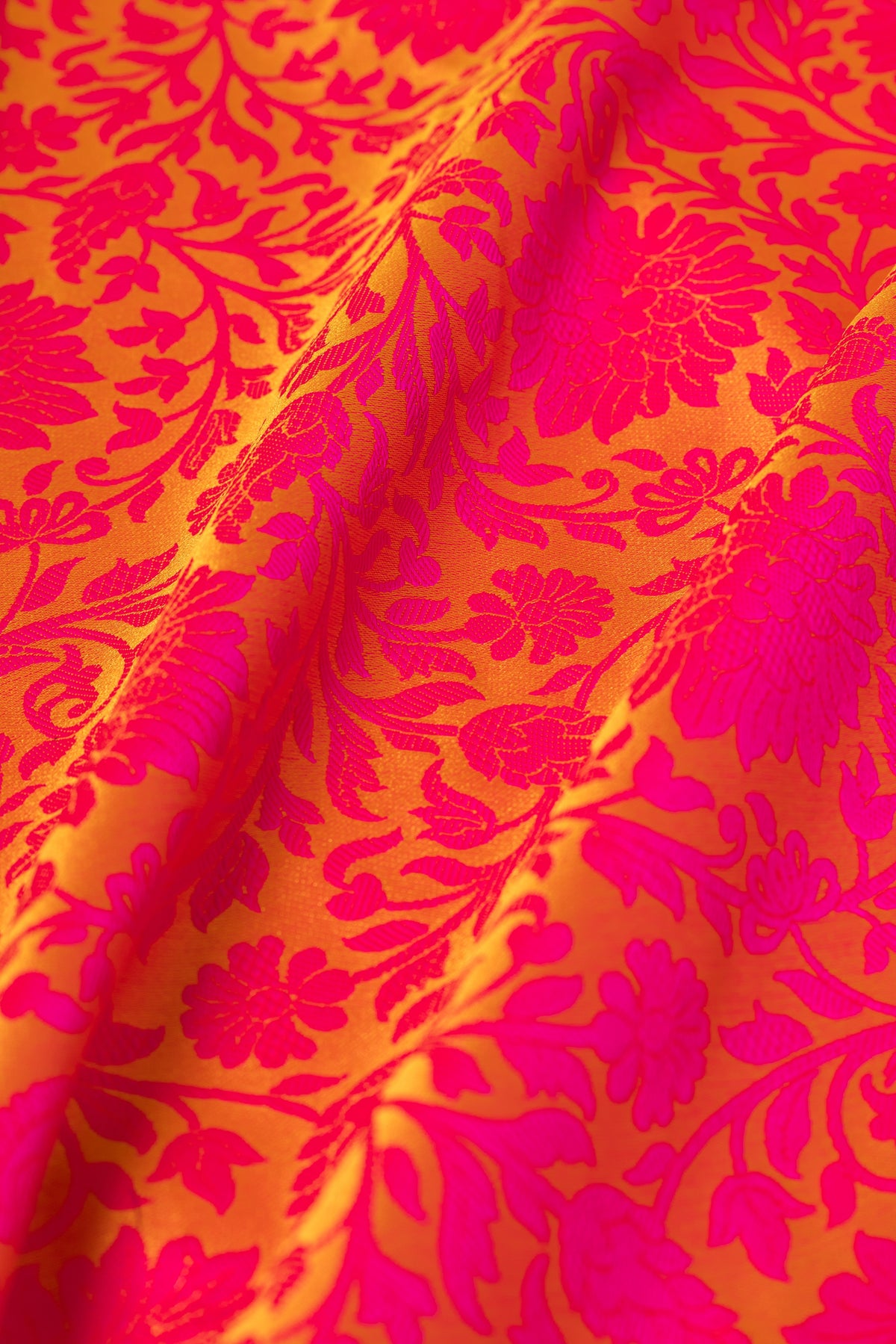 Mustard Yellow Katan Silk Banarasi Saree with Embossed Rani Pink Floral weave