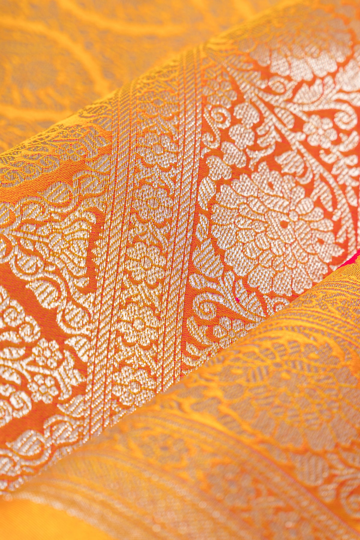 Mustard Yellow Katan Silk Banarasi Saree with Embossed Rani Pink Floral weave